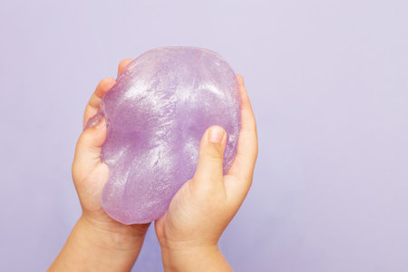 Making slime at home. child stretching colorful slime. DIY concept.の写真素材