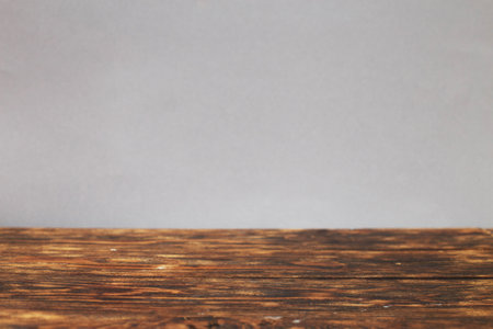 empty wooden brown table on a grey background.の写真素材