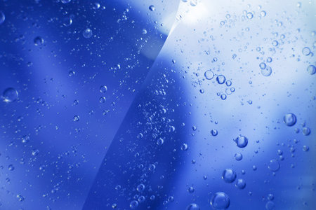 Oil bubbles close up. a circles of water macro. abstract light blue backgroundの写真素材