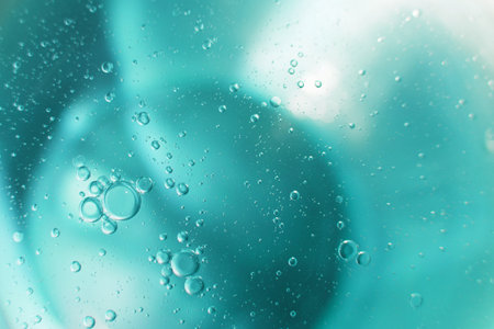 Oil bubbles close up. circles of water macro. abstract light blue backgroundの写真素材