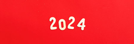 Wooden numbers 2024 on red background. Christmas, New Year, winter holidays sale and festive mood concept.の写真素材