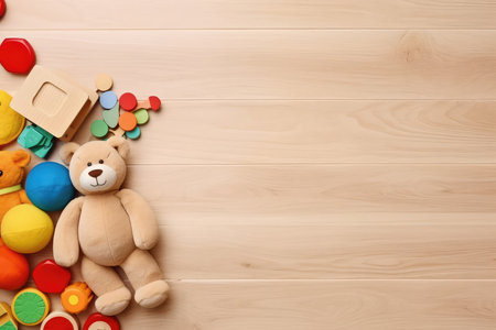 Top view of kids toys frame on wooden background with copy space. Educational development toy for kids. Children leisure and entertainment conceptの素材