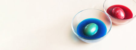 Top view photo of Easter eggs painting and coloring. festive painted Easter eggs with colorful dyes...