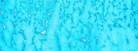 Old blue turquoise paint peeling from concrete or metal wall background. Texture of an old grunge...