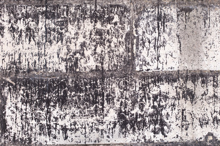 Old brick black color wall background. Dark stone texture.の写真素材