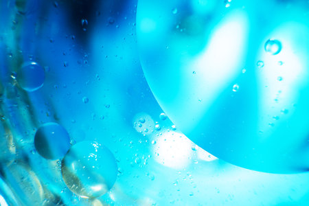abstract light blue background with oil circles . bubbles of water close up. oil bubbles in the water macro. circle bubbles backgroundの写真素材