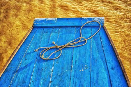 shot in the river when the sun nearly down make the color of water like thisthis shot is very sharp nice contrastmade for abstract felling   Boat should not blue, River should not yellowの写真素材