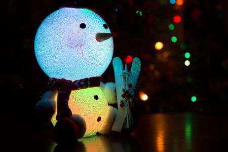 Snowman on a Christmas tree backgroundの写真素材