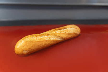 Fresh pastries are on the red table