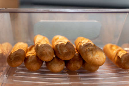 fresh pastries are on the counter of the storeの写真素材