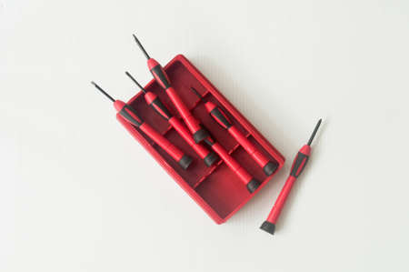 Red and black screw driver in a red box