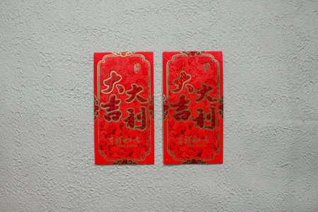 Red angpao isolated on a white background, symbolizing good luck, prosperity, and happiness in...