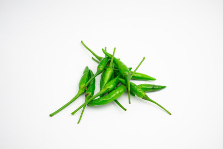 Green cayenne peppers in clusters. isolated on white background.の写真素材