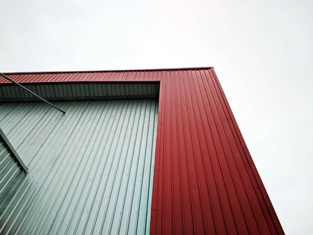 Factory exterior painting with red color and gray