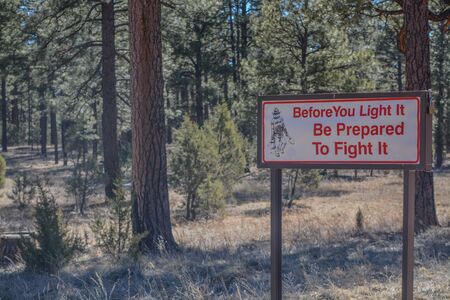 Before You Light It, Prepare To Fight It, sign. Overheard, Navajo County, Sitgreaves National Forest, Arizona USAの写真素材