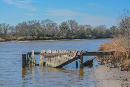 The Carl Parks decaying pier on the Tres Palacios River in El Campo, Matagorda County, Texasの写真素材