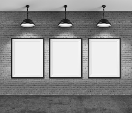 Art gallery. Blank picture frames on brick wall background.の写真素材