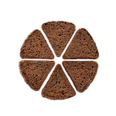 Rye baked bread slices isolated on white background. Top view