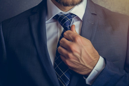 Businessman Perfecting His Tie. Generative ai. High quality illustrationの素材