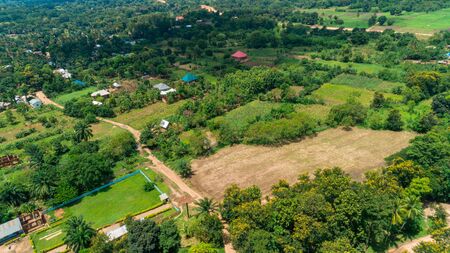 Aerial view of endless lush pastures and farmlands of morogoro town, Tanzaniaの写真素材