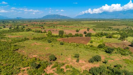 Aerial view of endless lush pastures and farmlands of morogoro town, Tanzaniaの写真素材