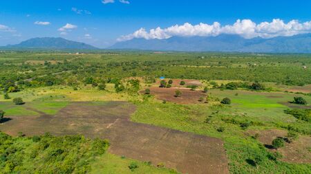 Aerial view of endless lush pastures and farmlands of morogoro town, Tanzaniaの写真素材