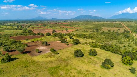 Aerial view of endless lush pastures and farmlands of morogoro town, Tanzaniaの写真素材