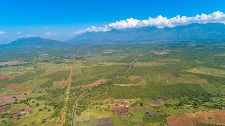 Aerial view of endless lush pastures and farmlands of morogoro town, Tanzaniaの写真素材