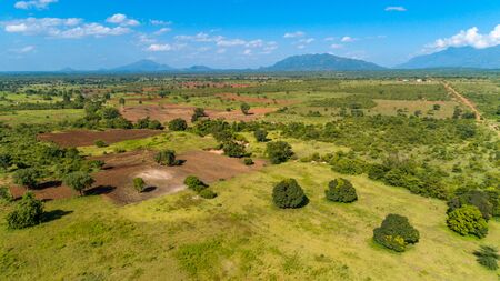 Aerial view of endless lush pastures and farmlands of morogoro town, Tanzaniaの写真素材