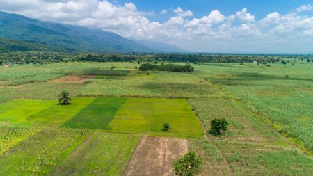 Aerial view of endless lush pastures and farmlands of morogoro town, Tanzaniaの写真素材