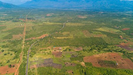 Aerial view of endless lush pastures and farmlands of morogoro town, Tanzaniaの写真素材