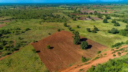 Aerial view of endless lush pastures and farmlands of morogoro town, Tanzaniaの写真素材