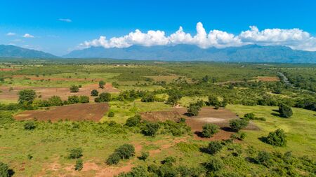 Aerial view of endless lush pastures and farmlands of morogoro town, Tanzaniaの写真素材