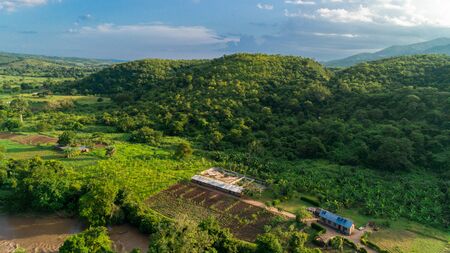 Aerial view of endless lush pastures and farmlands of morogoro town, Tanzaniaの写真素材