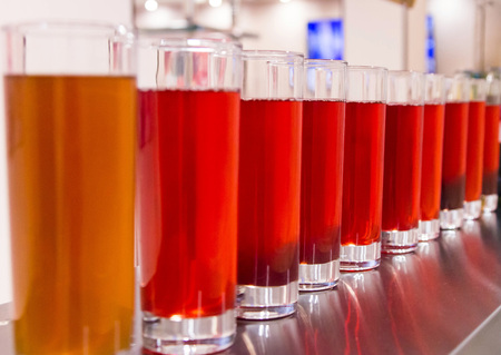 A glass of red color with selective focusの写真素材