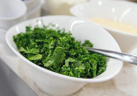 Plate with chopped Greensの写真素材