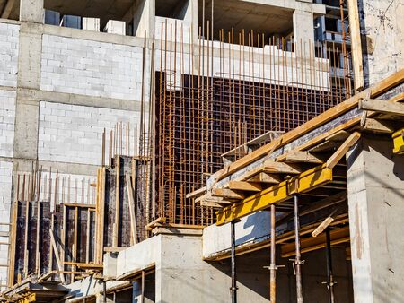 Preparation for pouring a concrete wall at the construction site of a high-rise building. Formwork,...