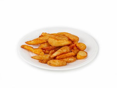 Portion of french fries on a plate, in a rustic style. Crisp, fast food. Close up, isolateの写真素材