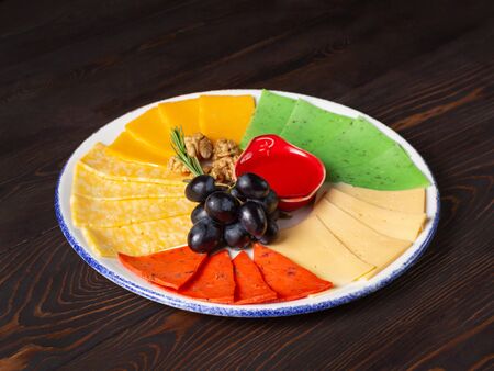 Varied cheese on a plate for a wine tasting ceremony. Close up, selective focusの写真素材