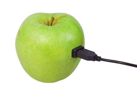 Green apple connected via usb cable. Isolated.の写真素材