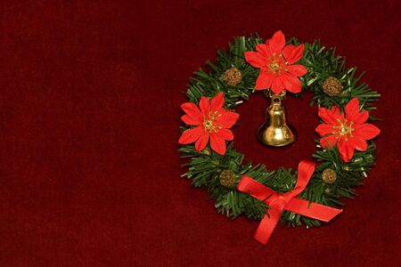 Christmas garland on scarlet velvet background.の写真素材