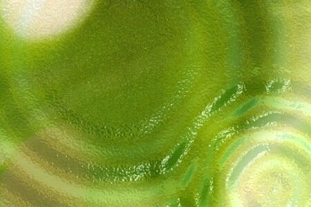 Abstract green background with ripples motif.