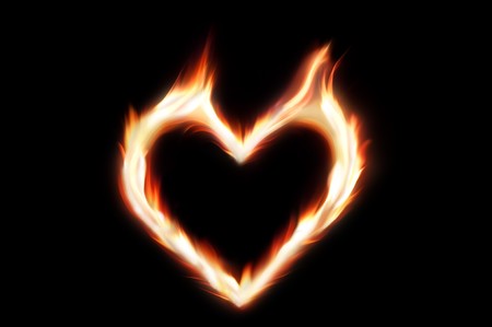 Flaming heart of fire - symbol of passionate loveの写真素材