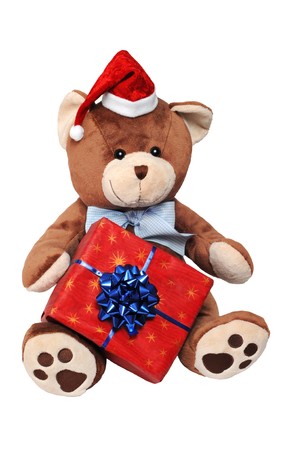Christmas teddy bear with a gift isolated on white background.の写真素材
