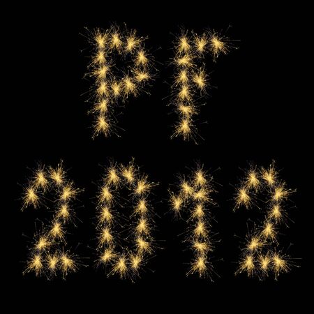 The Seasons greetings (PF) with year 2012 shaped by fire sparksの写真素材