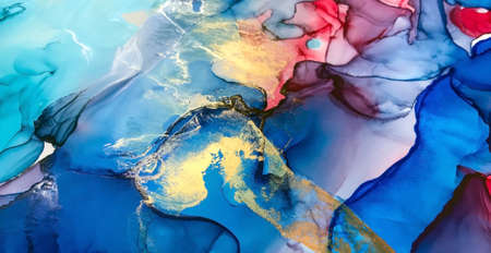 Gold foil paint on cyan and blue marble ink texture. Abstract art glitter luxury background.