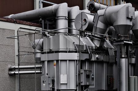 Heavy steel transformer at a biomass power plantの写真素材