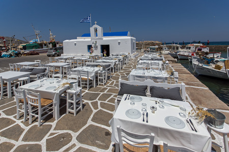white church and restaurant in Naousa town Paros island Cycladesのeditorial素材
