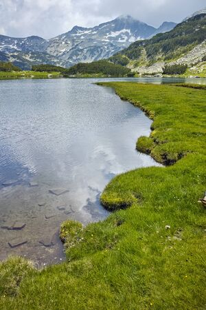 Amazing view of  green meadows around Muratovo lake, Pirin Mountain, Bulgariaの写真素材