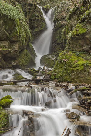 wonderful view of  Leshnishki Waterfall in deep forest, Belasitsa Mountain, Bulgariaの写真素材
